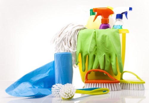 Detailed cleaning of a living room sofa in West London